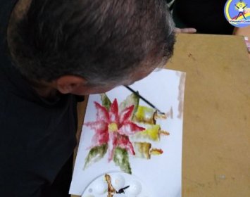 Joel Ramos en el Dia Munidal Pintor Boca y Pie